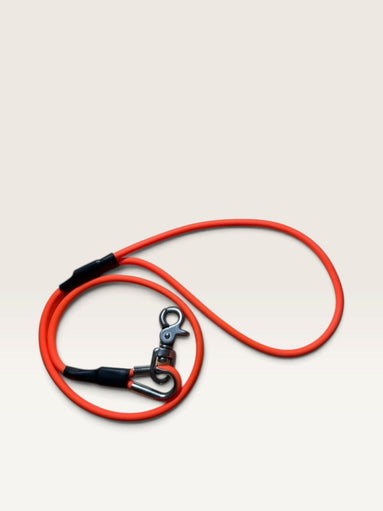 Red Maple K9 Gear vibrant orange waterproof dog training leash with a heavy-duty rust-resistant swivel snap hook.