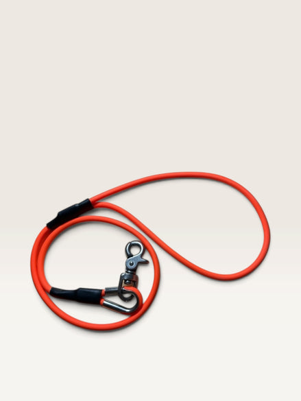Red Maple K9 Gear vibrant orange waterproof dog training leash with a heavy-duty rust-resistant swivel snap hook.